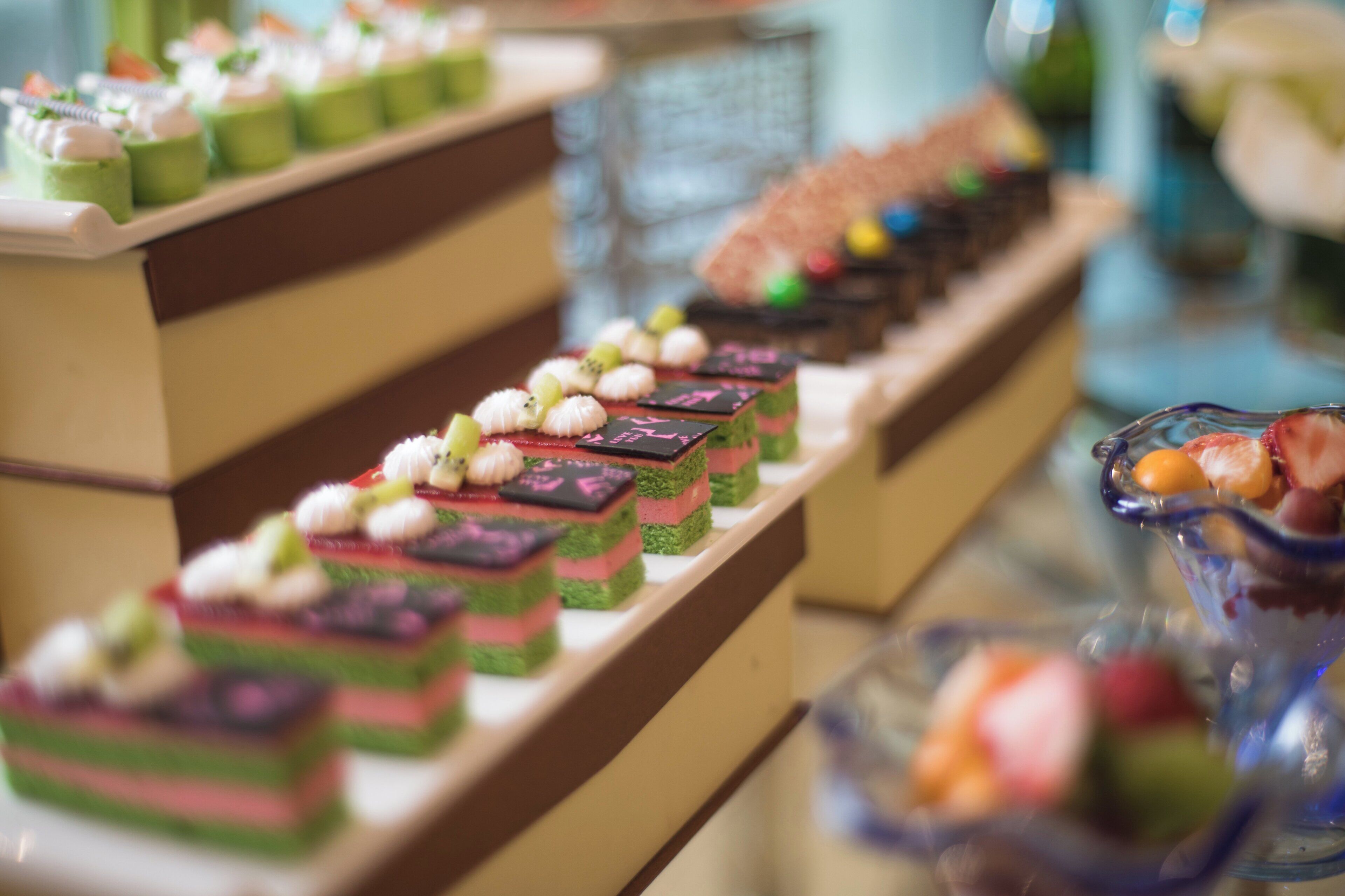 A dessert display with various colorful treats.