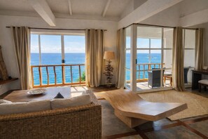 Suite, Sea View | Minibar, in-room safe, individually decorated, individually furnished