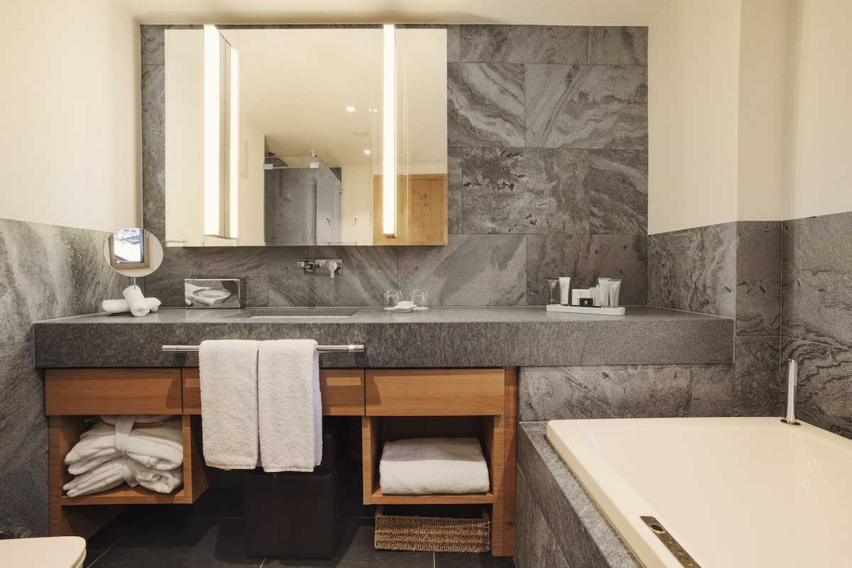 rainfall showerhead, designer toiletries, hair dryer, bathrobes