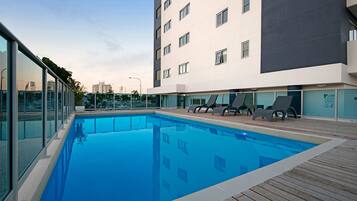 Outdoor pool, open 7:00 AM to 7:00 PM, sun loungers