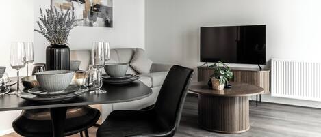 Superior Apartment, 1 Bedroom, Balcony | Living area | 55-inch Smart TV with digital channels