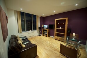 Apartment, 1 Bedroom (Sleeps 4) | Living room | Flat-screen TV, DVD player