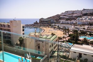 A coastal resort with a pool, beach, and hotel buildings. - IG Nachosol Atlantic & Yaizasol by Servatur (Mogan)