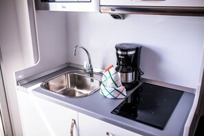 A kitchen with a sink, a coffee maker, and a towel. - IG Nachosol Atlantic & Yaizasol by Servatur (Mogan)
