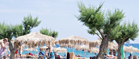 On the beach, sun-loungers, beach umbrellas