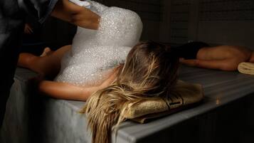 Experience a rejuvenating massage on a comfortable table in a serene space.