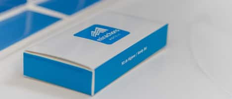 A blue and white box with the Mirachore Hotel logo and text indicating it is a hygiene kit.
