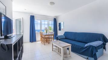 Superior Apartment, 1 Bedroom | Living room | 21-inch TV with digital channels