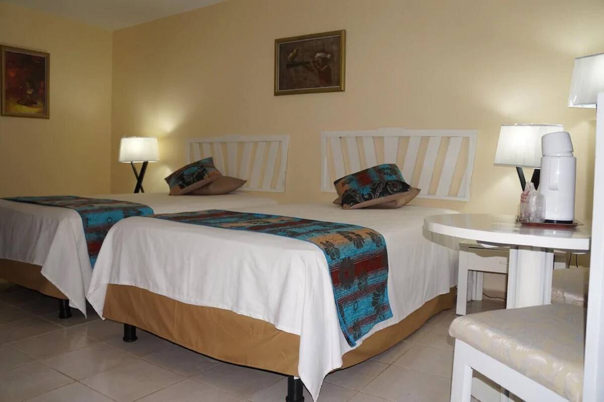 Individually furnished, desk, laptop workspace, iron/ironing board