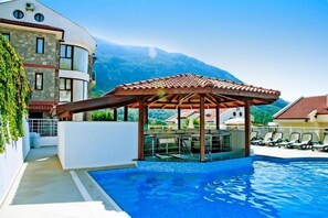 2 outdoor pools, pool umbrellas, pool loungers - Golden Life Heights Deluxe Suite Hotel - Adults Only (Fethiye)