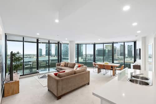 Three Bedroom Executive Apartment River View | Living area | 50-inch flat-screen TV with digital channels, TV