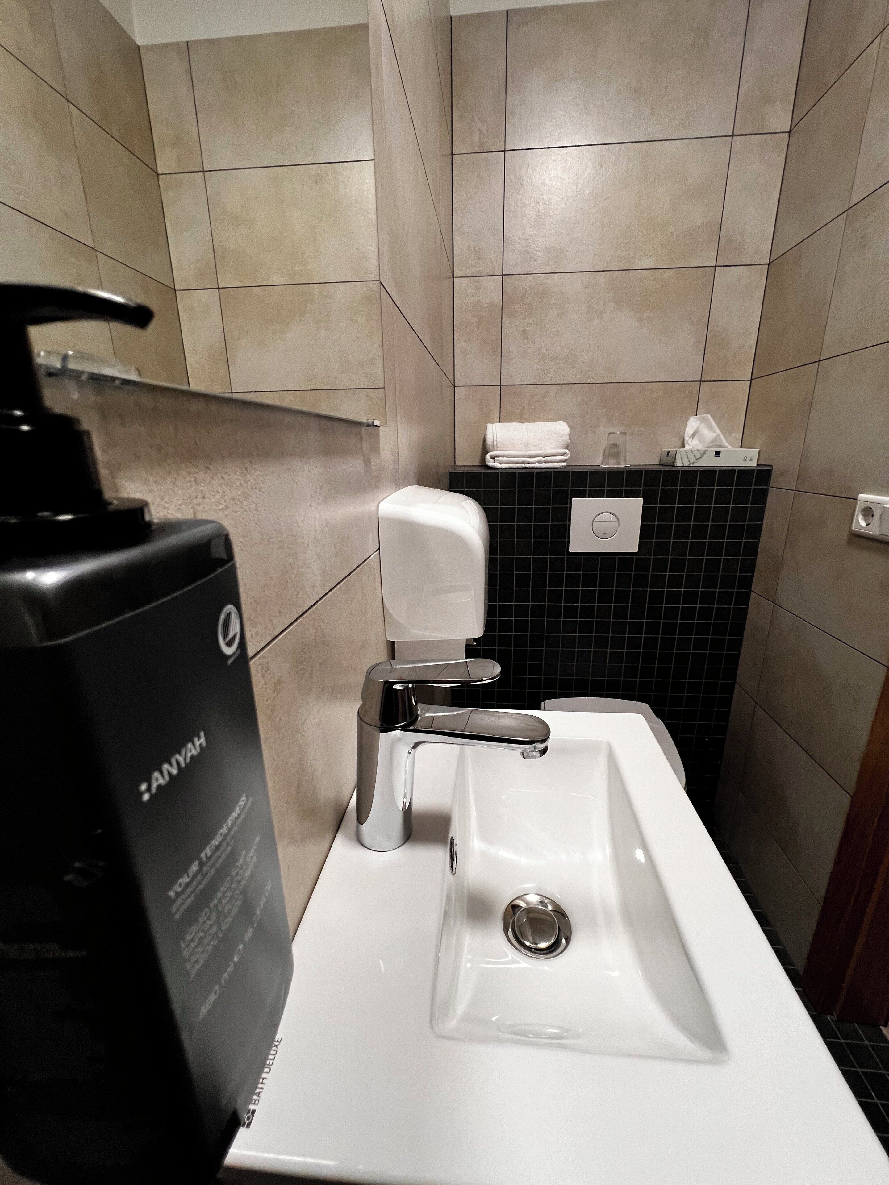 shower, rainfall showerhead, hair dryer, towels