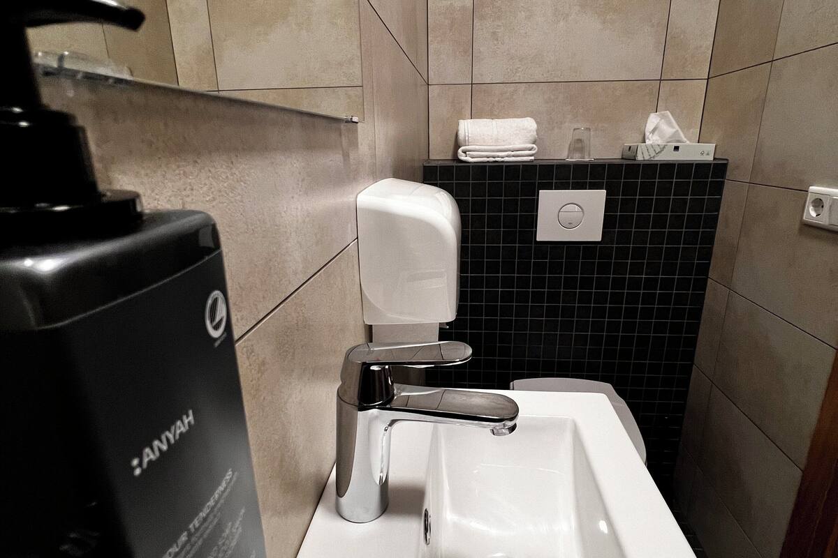 shower, rainfall showerhead, hair dryer, towels