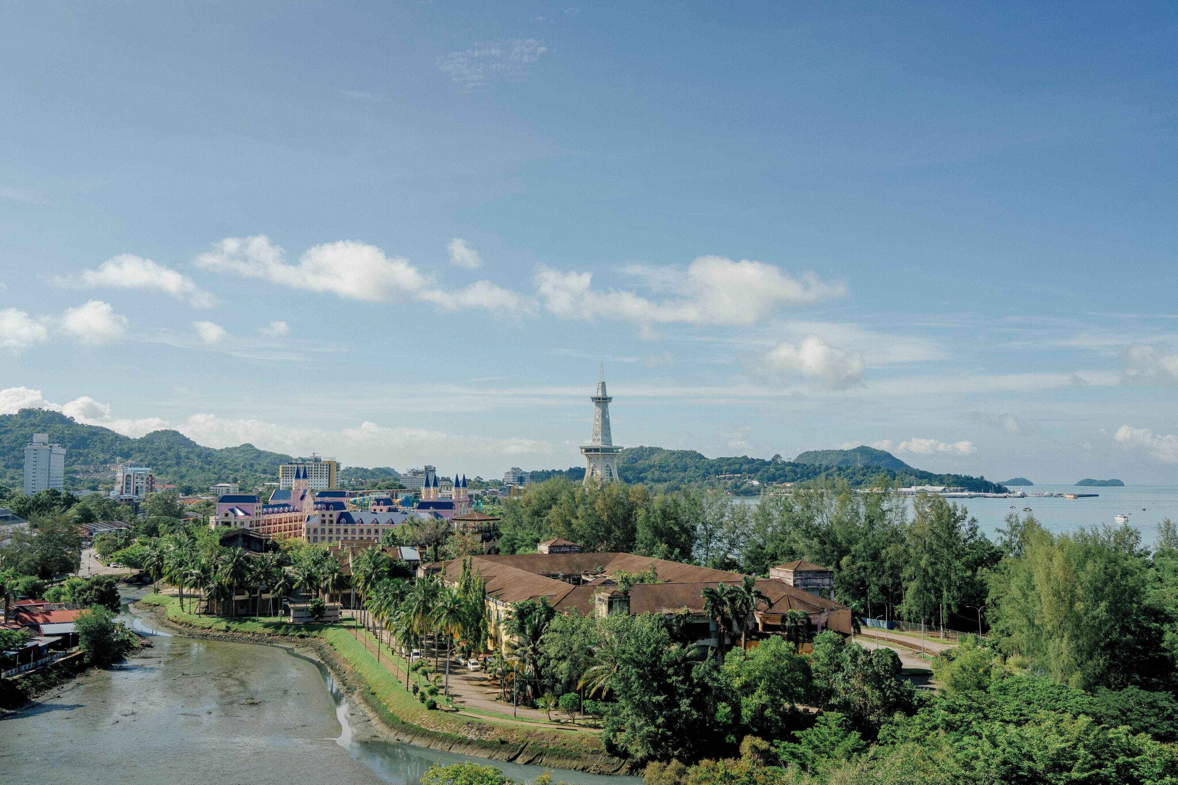 A river, buildings, and a tower.