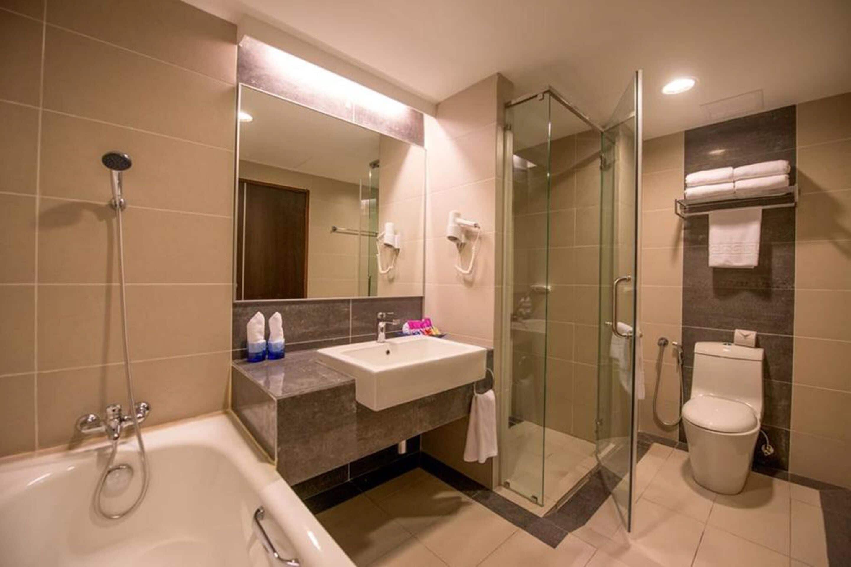 premier suite  | bathroom | shower, hair dryer, slippers, towels
