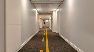 Standard Apartment, Multiple Beds | Minibar, in-room safe, desk, laptop workspace