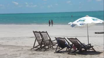 On the beach, sun loungers, beach umbrellas, beach towels
