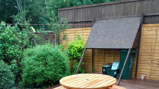 A wooden deck with a picnic table and benches. - Bristol Serviced Lettings - Filton (Bristol)