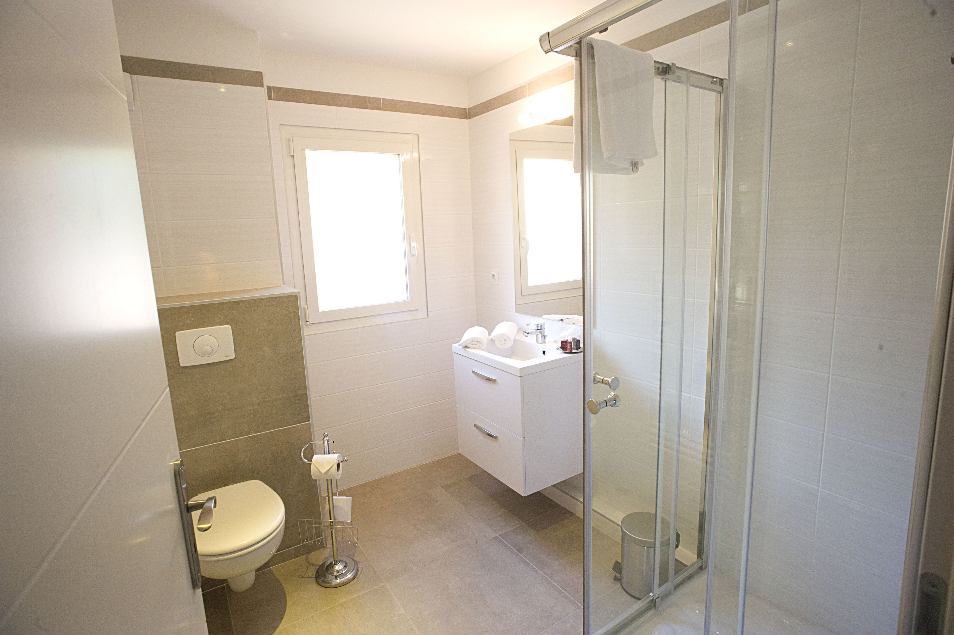 superior room | bathroom | shower, hair dryer, towels