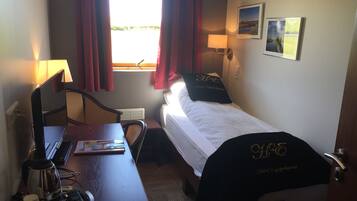 Habitación individual estándar | Cortinas blackout, cunas gratuitas, wifi gratis y ropa de cama