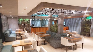 A modern interior with seating arrangements, a bar area, and decorative elements.