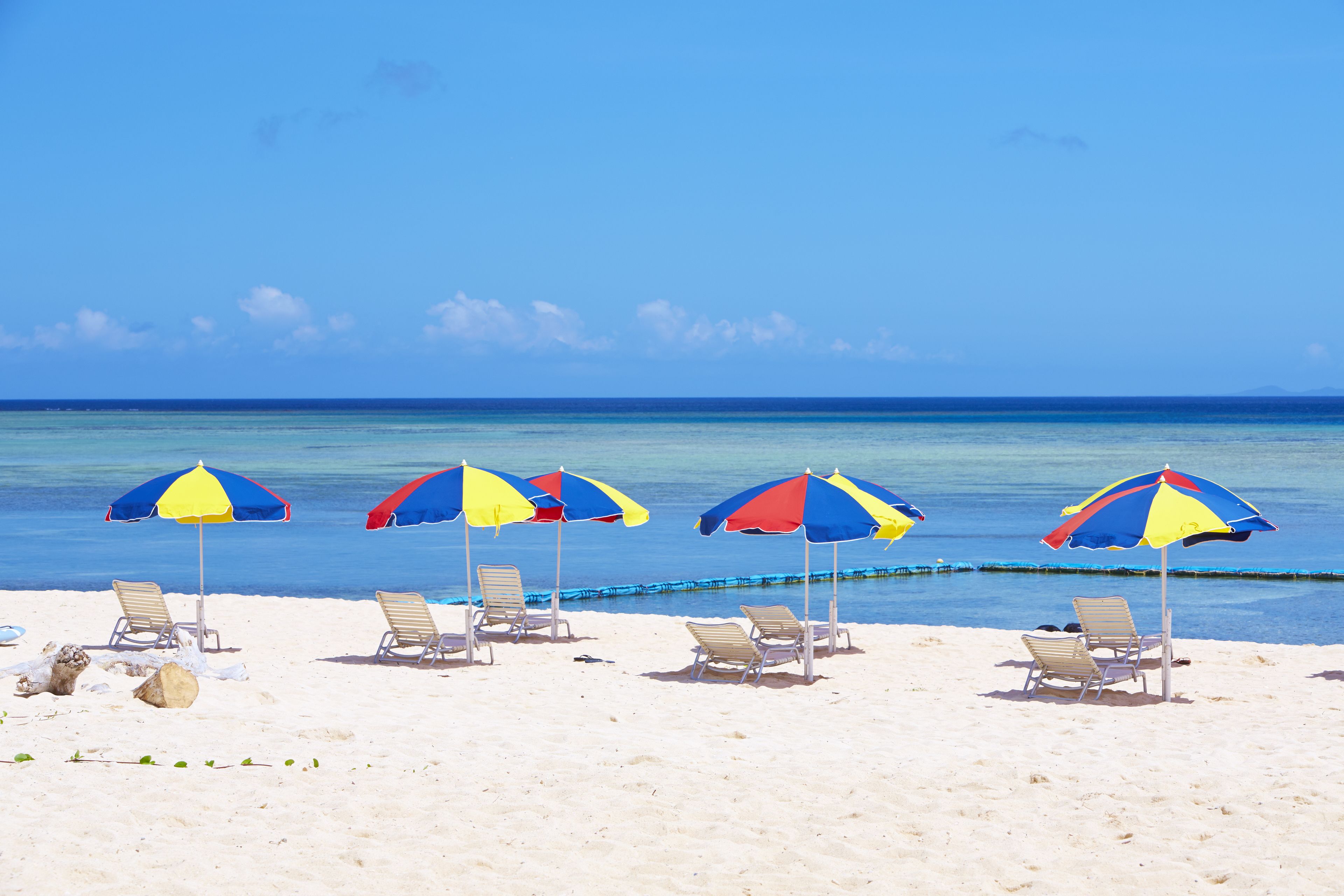Private beach, white sand, sun loungers, beach umbrellas