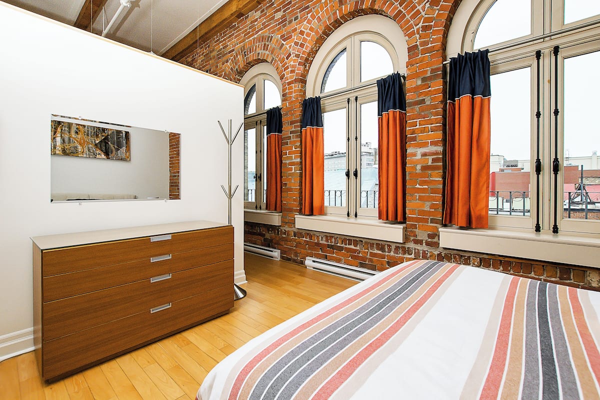 Apartment, 1 Bedroom, single beds accessible by ladder (Loft #304) | Soundproofing, iron/ironing board, travel crib, free WiFi
