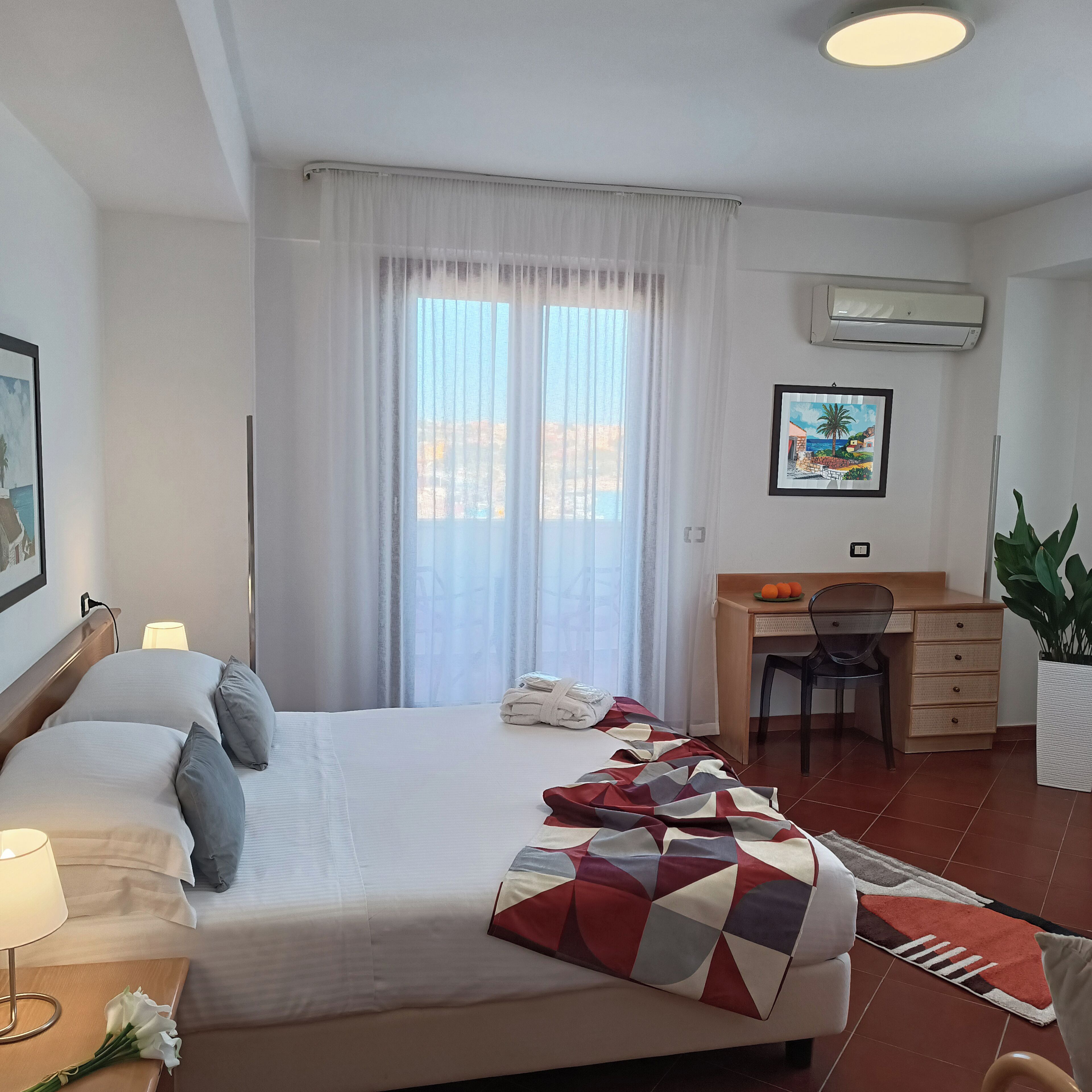 junior suite, 1 queen bed, terrace, sea view | 1 bedroom, minibar, in-room safe, desk
