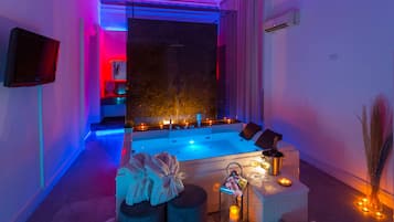 Luxury Room, 1 Queen Bed, Hot Tub, City View | Down comforters, desk, soundproofing, iron/ironing board