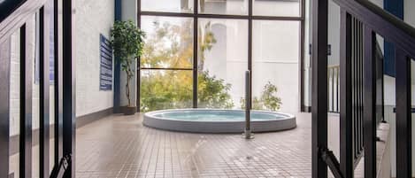 Indoor pool, open 8:00 AM to 10:00 PM, pool loungers