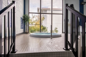 Indoor pool, open 8:00 AM to 10:00 PM, pool loungers