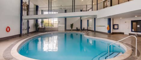 Indoor pool, open 8:00 AM to 10:00 PM, pool loungers