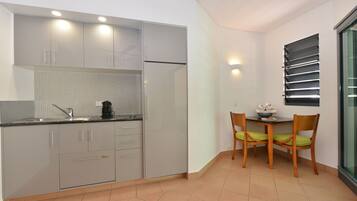 Apartment, 1 Bedroom, Pool View | Private kitchenette | Fridge, microwave, stovetop, electric kettle
