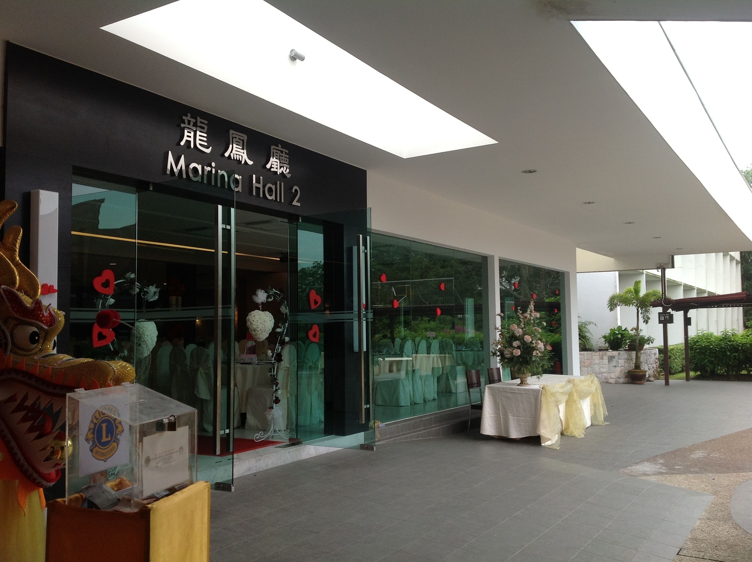 A modern building with a sign reading "Marina Hall 2".