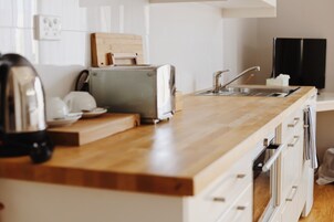 Kitchenette Suite  | Private kitchen | Fridge, coffee/tea maker, electric kettle