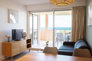 Apartment, 1 Bedroom (vue Mer) | Living area | Flat-screen TV