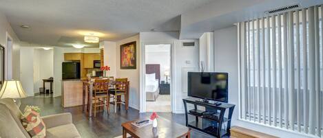 Executive Suite, 2 Bedrooms | Living room | 40-inch LCD TV with cable channels, TV, DVD player
