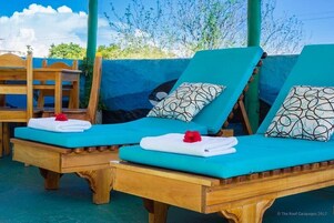 Outdoor pool, open 9:30 AM to 7:30 PM, pool umbrellas