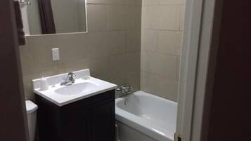 Combined shower/tub, hair dryer, towels, soap