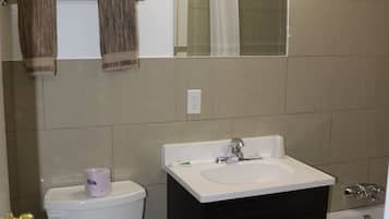 Combined shower/tub, hair dryer, towels, soap