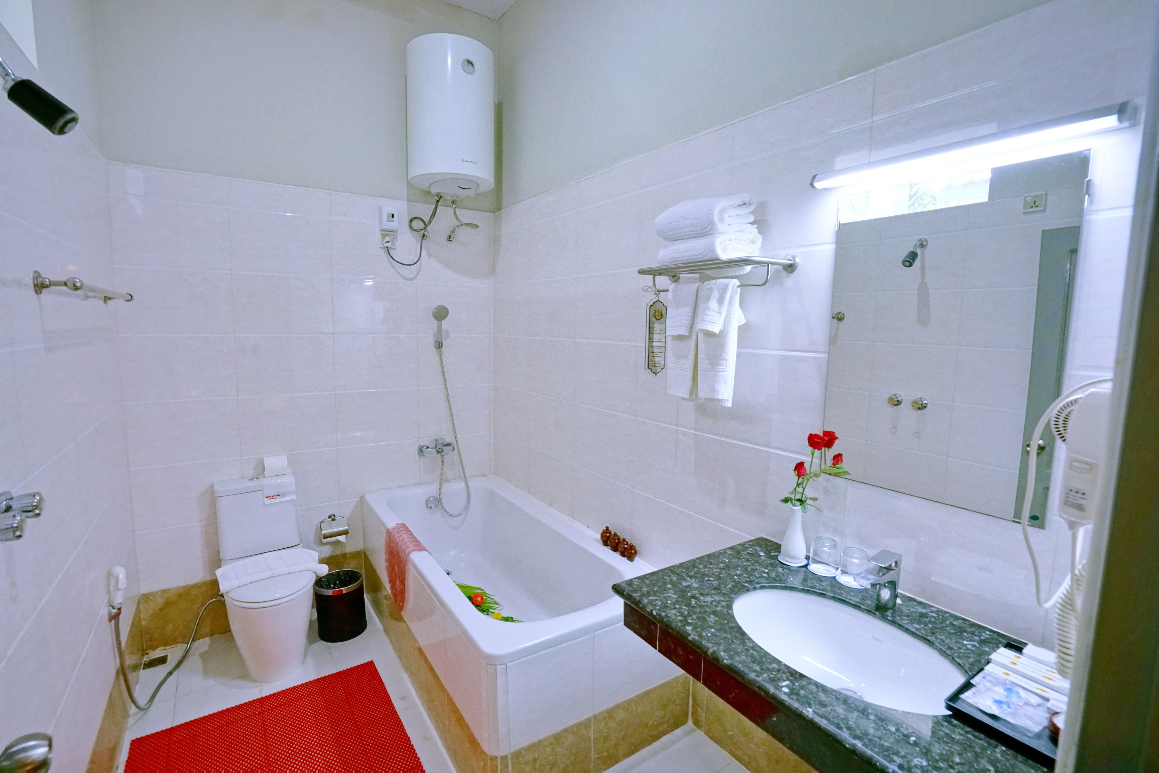 deluxe double or twin room | bathroom | rainfall showerhead, free toiletries, hair dryer, bathrobes