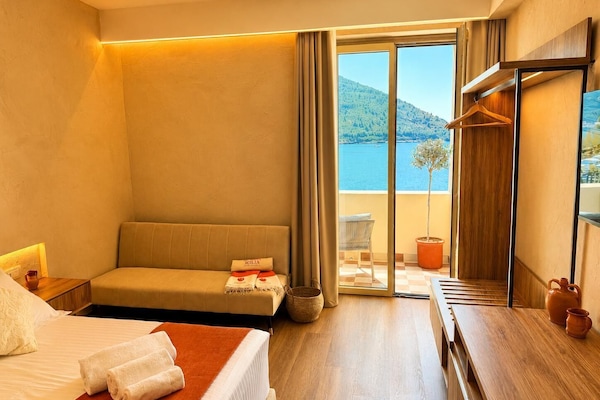 Comfort Triple Room, Partial Sea View | Premium bedding, minibar, in-room safe, desk