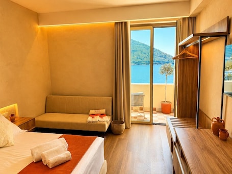 Comfort Triple Room, Partial Sea View | Premium bedding, minibar, in-room safe, desk