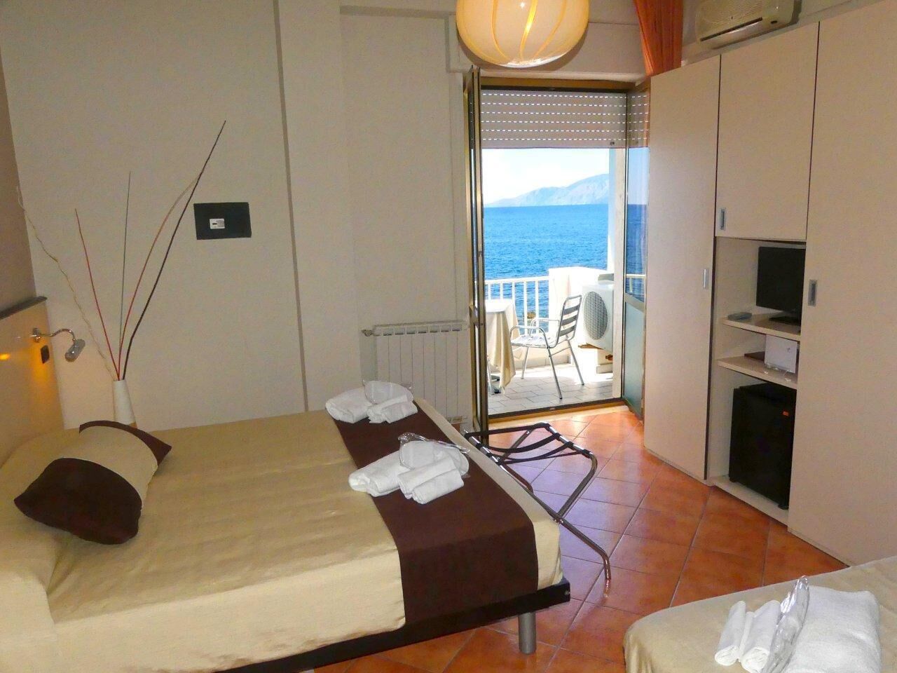 superior triple room, oceanfront | balcony