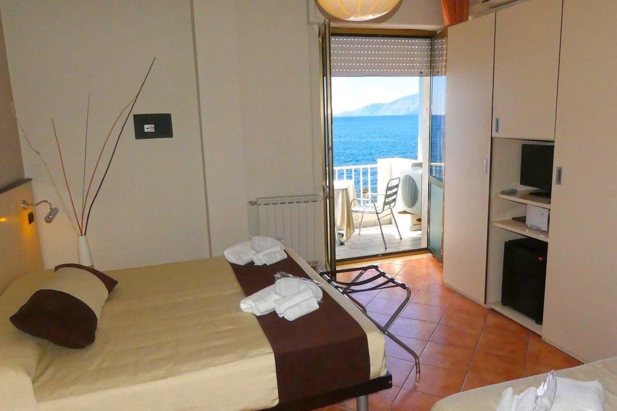 superior triple room, oceanfront | balcony