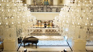 A grand lobby with a piano, ornate chandeliers, and a bar area. - Apricot Hotel (Hanoi)