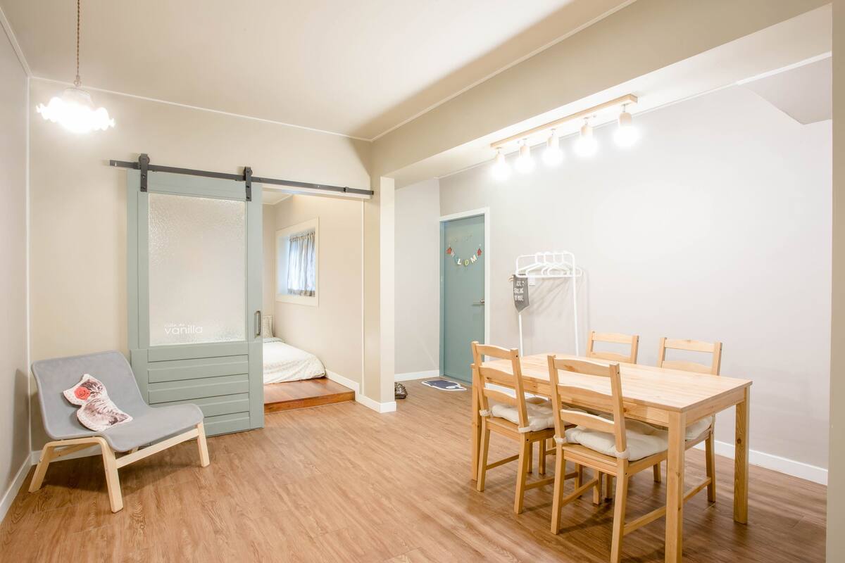 A room with a bed, a desk, and a chair.