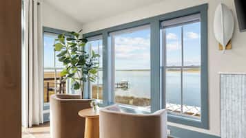 Deluxe Room, 1 King Bed, River View, Garden Area | In-room safe, individually decorated, individually furnished