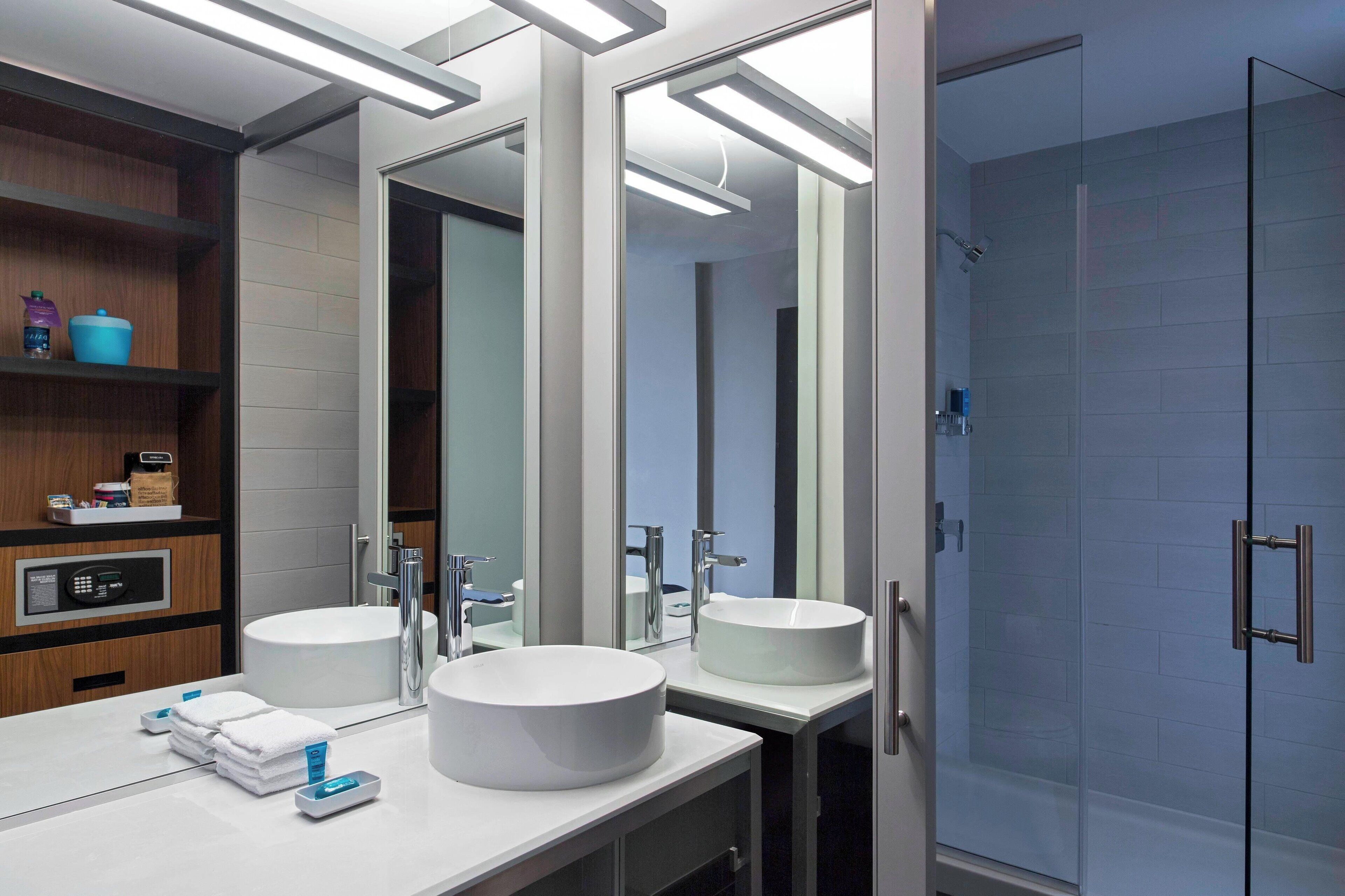 designer toiletries, hair dryer, towels