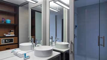 Designer toiletries, hair dryer, towels